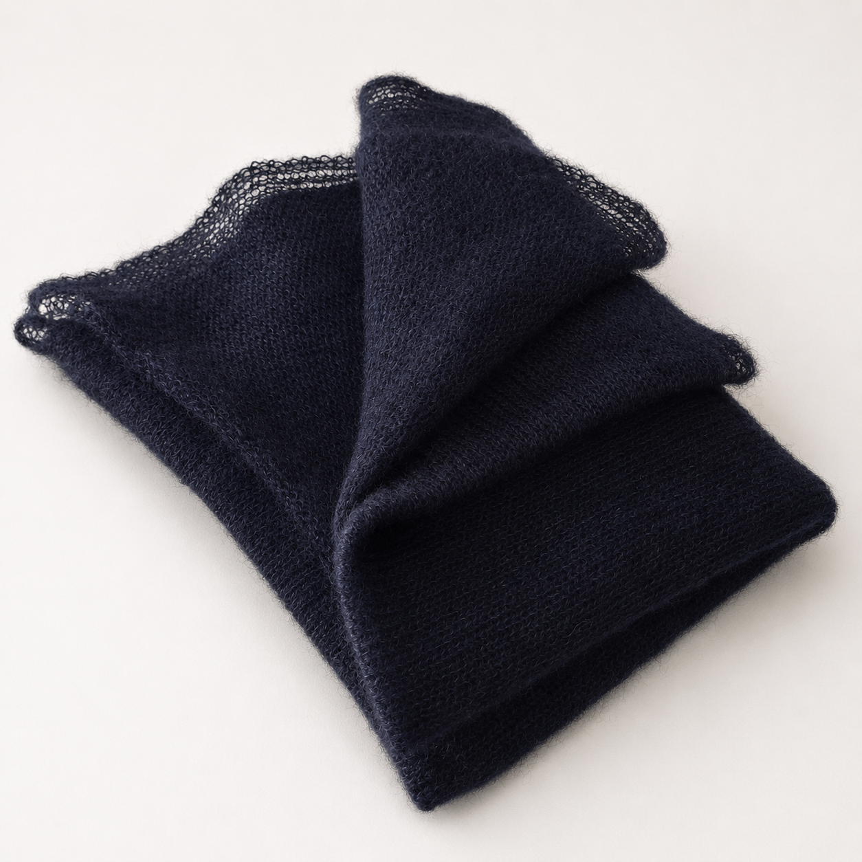 Folded Midnight Navy Silk Mohair Shawl highlighting its lightweight texture.