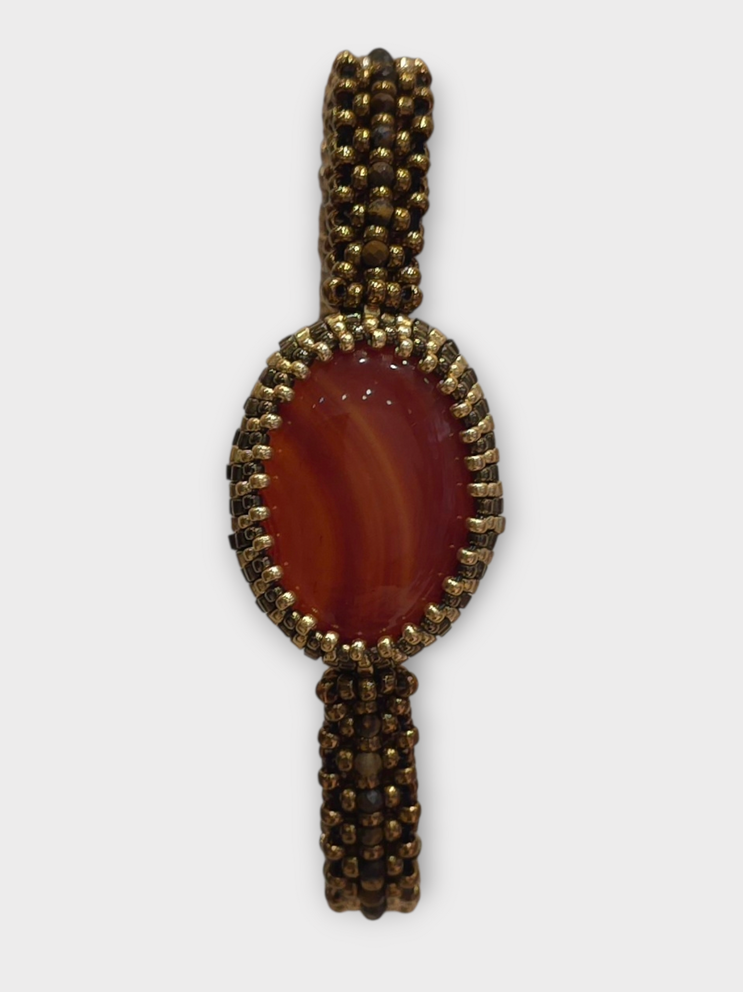 Armband aus Gold und Bronze mit Karneol-Cabochon-Perlen