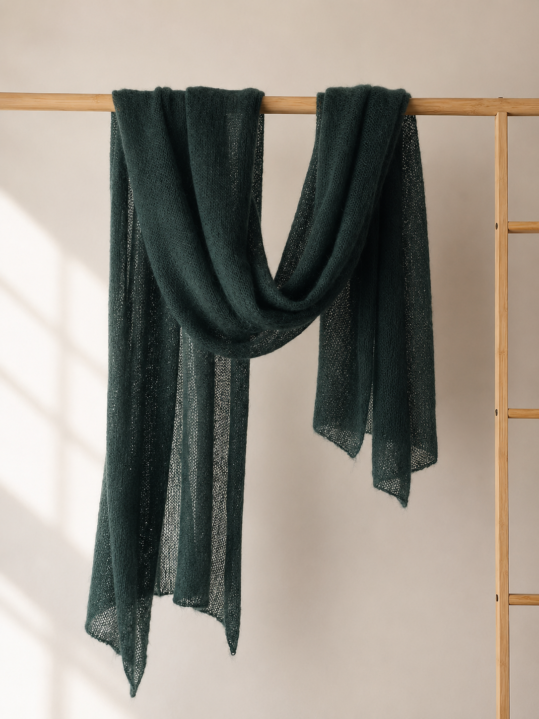 Deep Forest silk mohair shawl draped over a wooden rail in soft elegant folds
