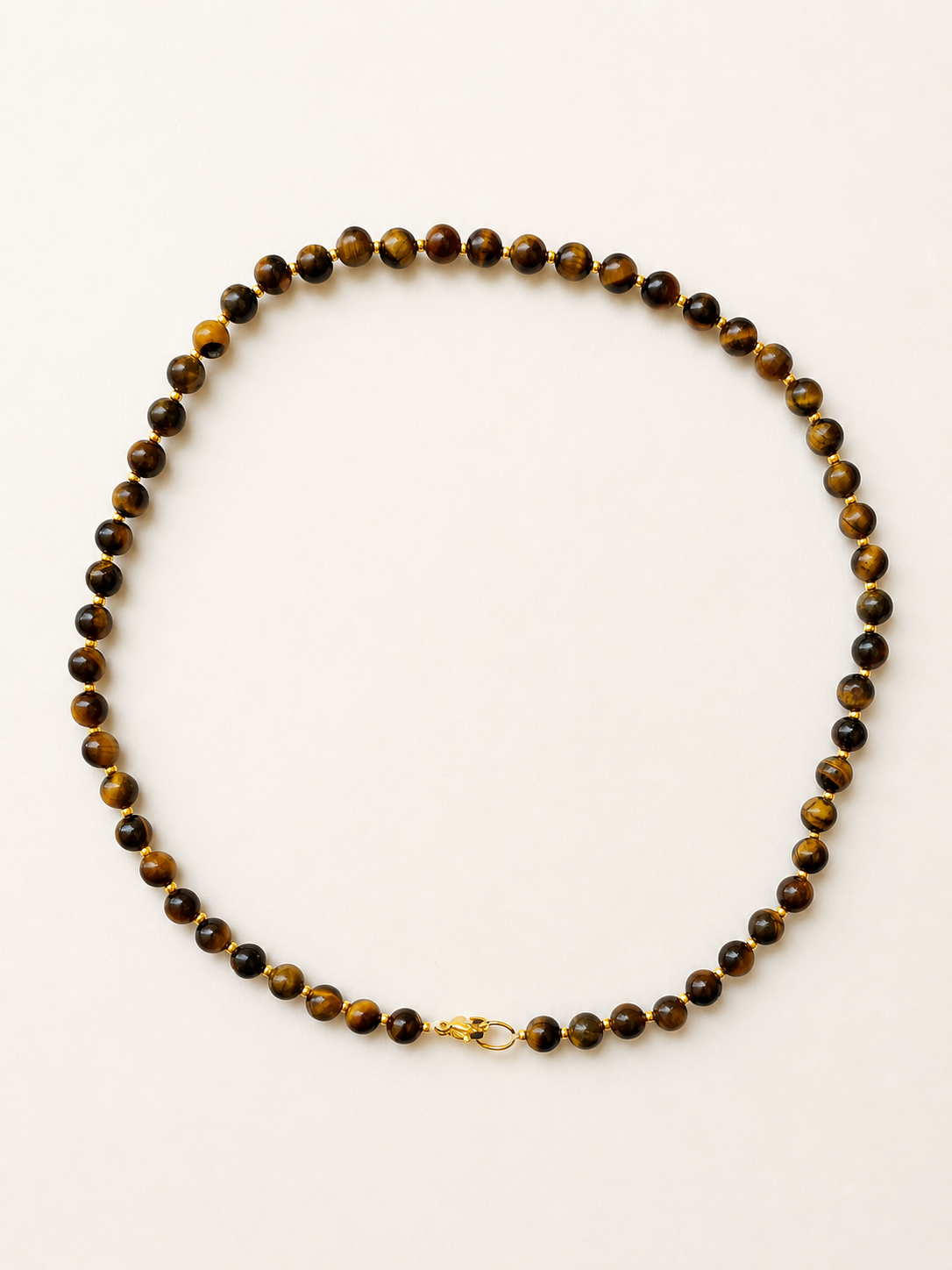 Tiger eye necklace with polished brown gemstone beads, gold Miyuki accents and a golden lobster clasp