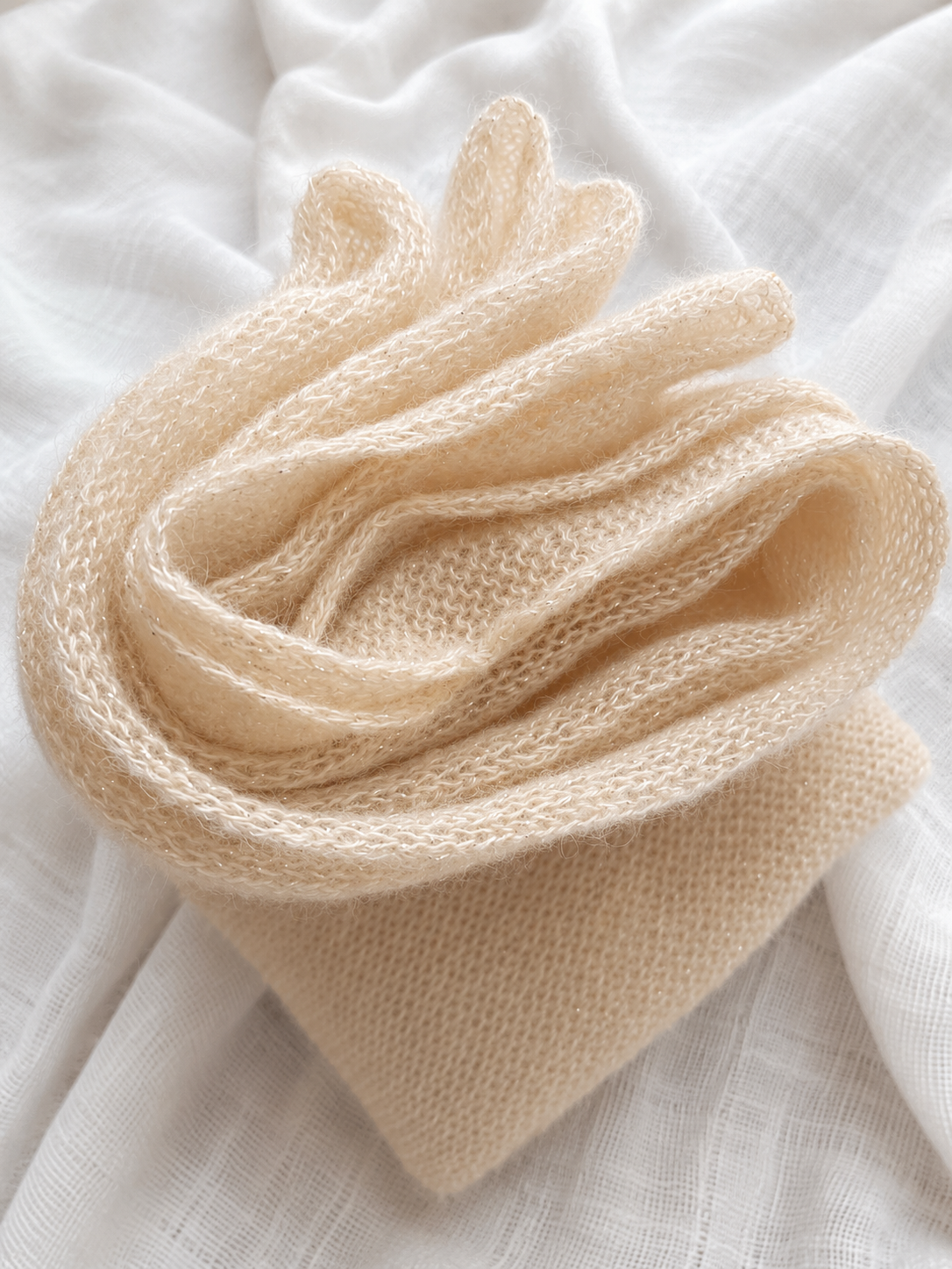 Folded Light Champagne Mohair Blend Infinity Scarf with subtle metallic shimmer.