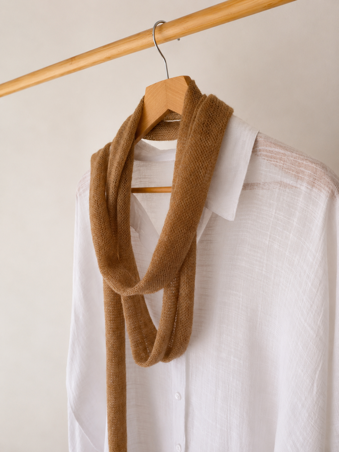Warm Camel handmade skinny kid mohair scarf photographed from a 45-degree angle.