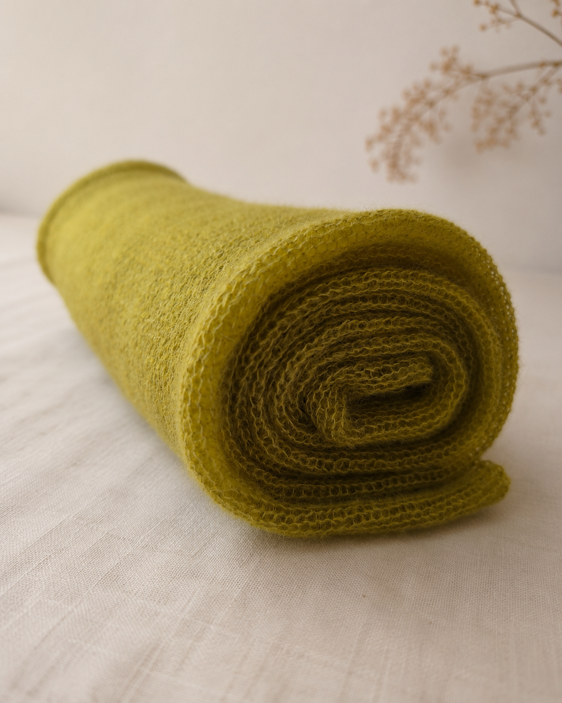 Rolled Moss Olive silk mohair shawl showing its soft lightweight knit texture