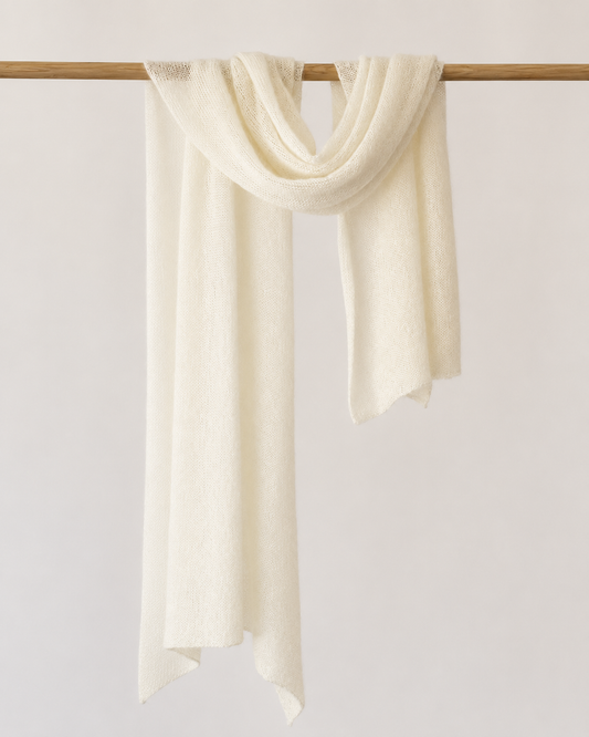 Cream Silk Mohair Shawl draped on a wooden rail