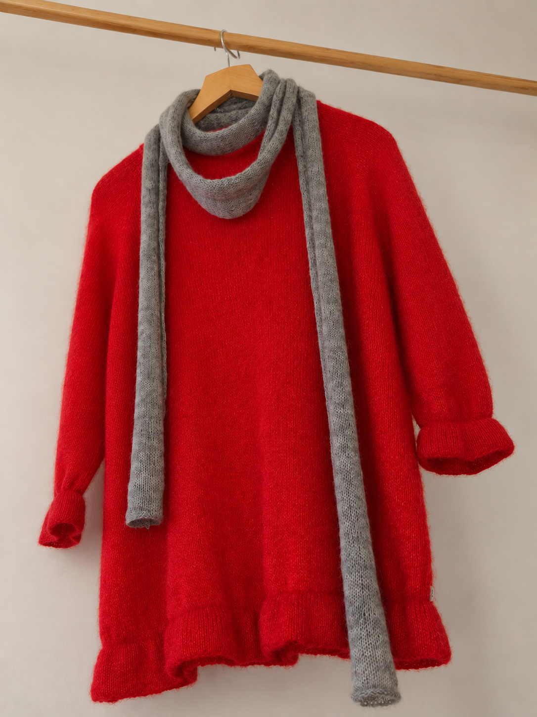 Handmade cloud grey skinny mohair scarf styled with a soft knit sweater.