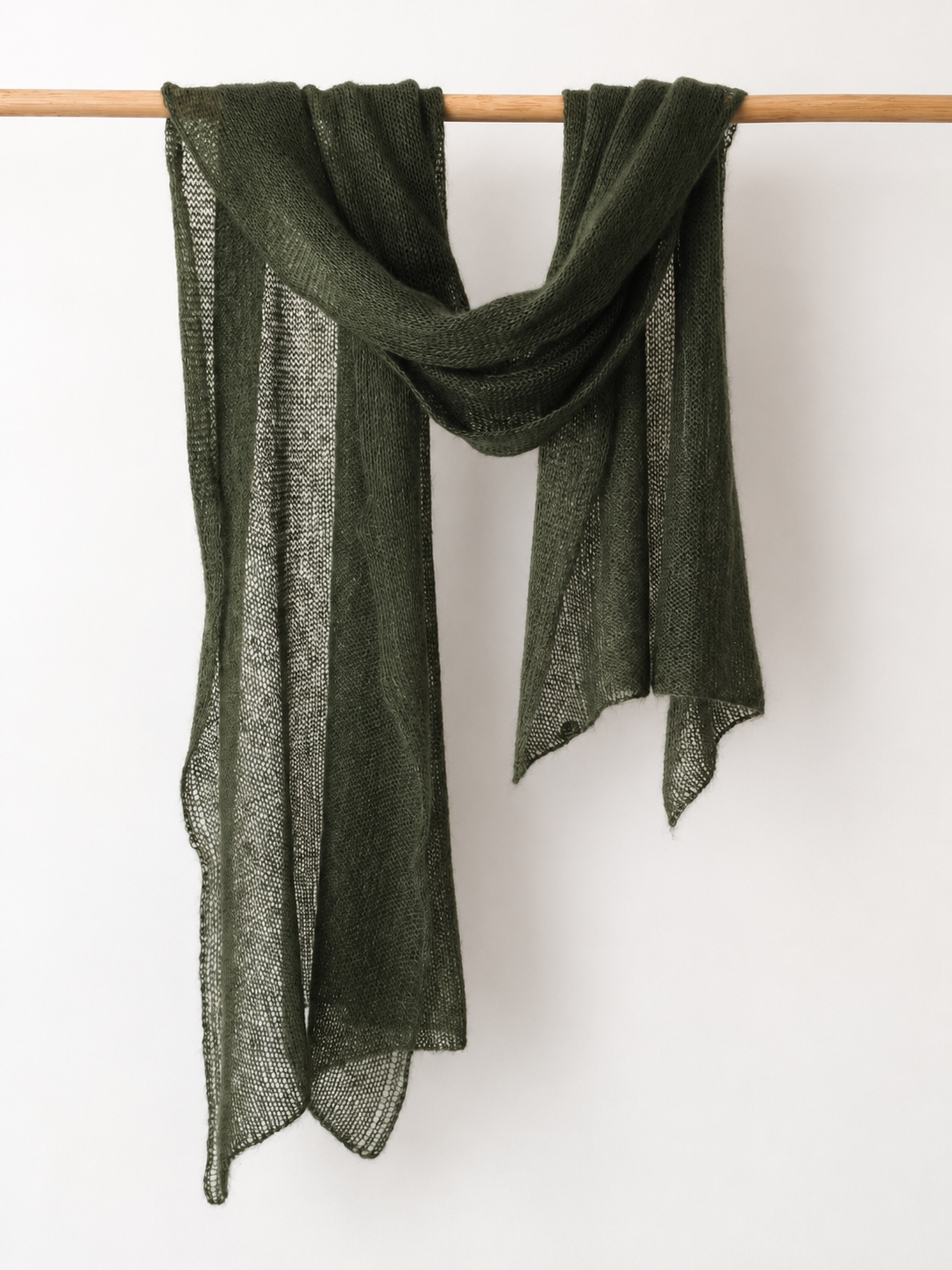 Moss Whisper silk mohair shawl draped over a wooden rail in soft natural folds