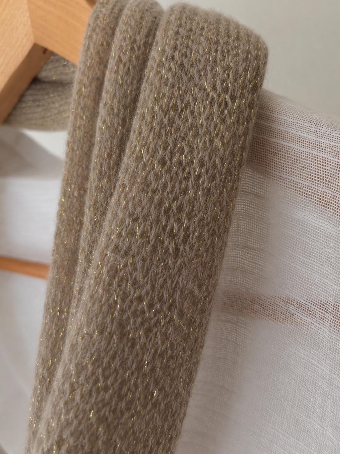 Close-up of the scarf's soft mohair texture and metallic thread.