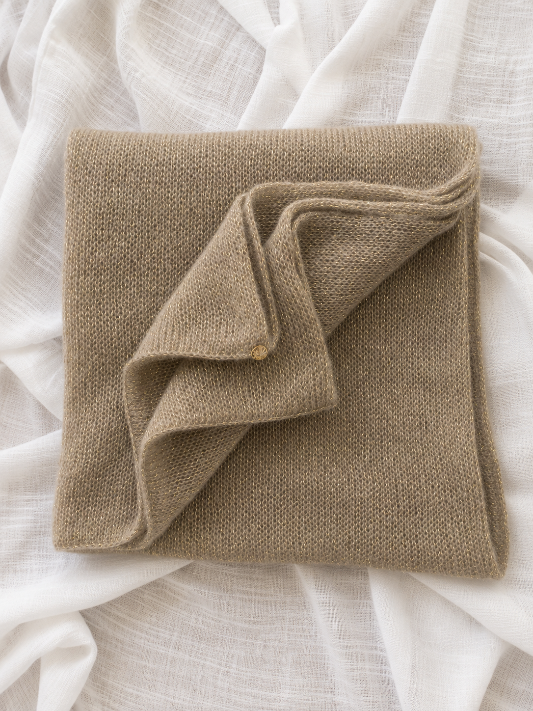 Folded Mushroom Infinity Scarf showing its soft knitted texture.
