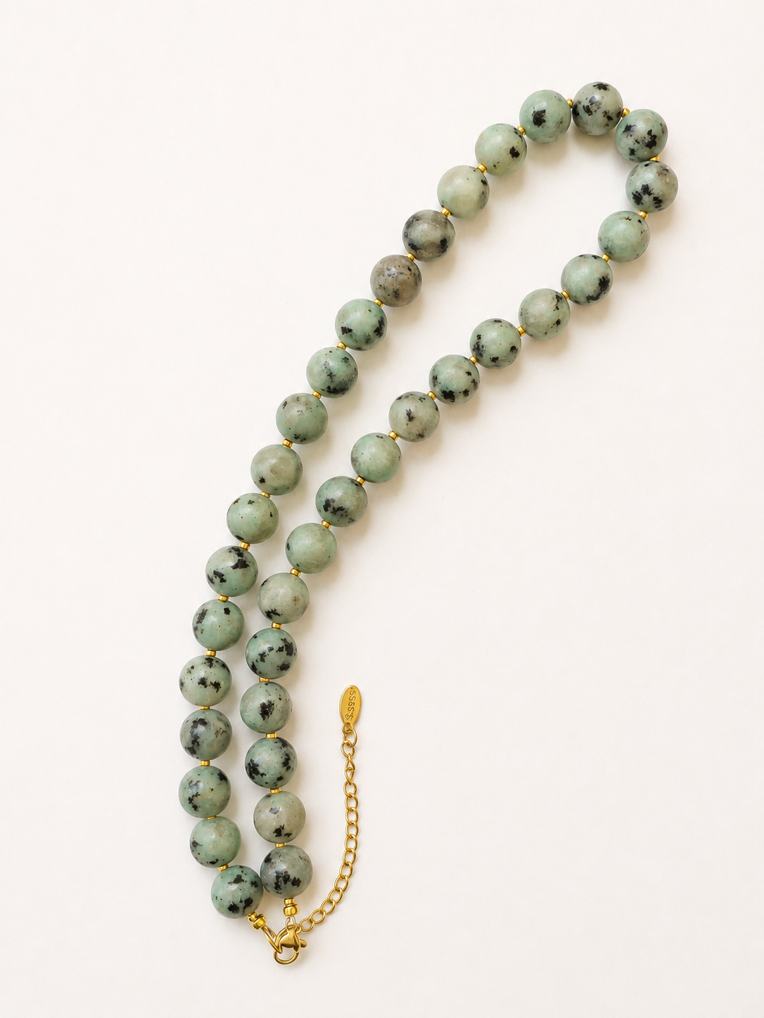 Full-length kiwi jasper gemstone necklace with golden clasp and adjustable extension chain