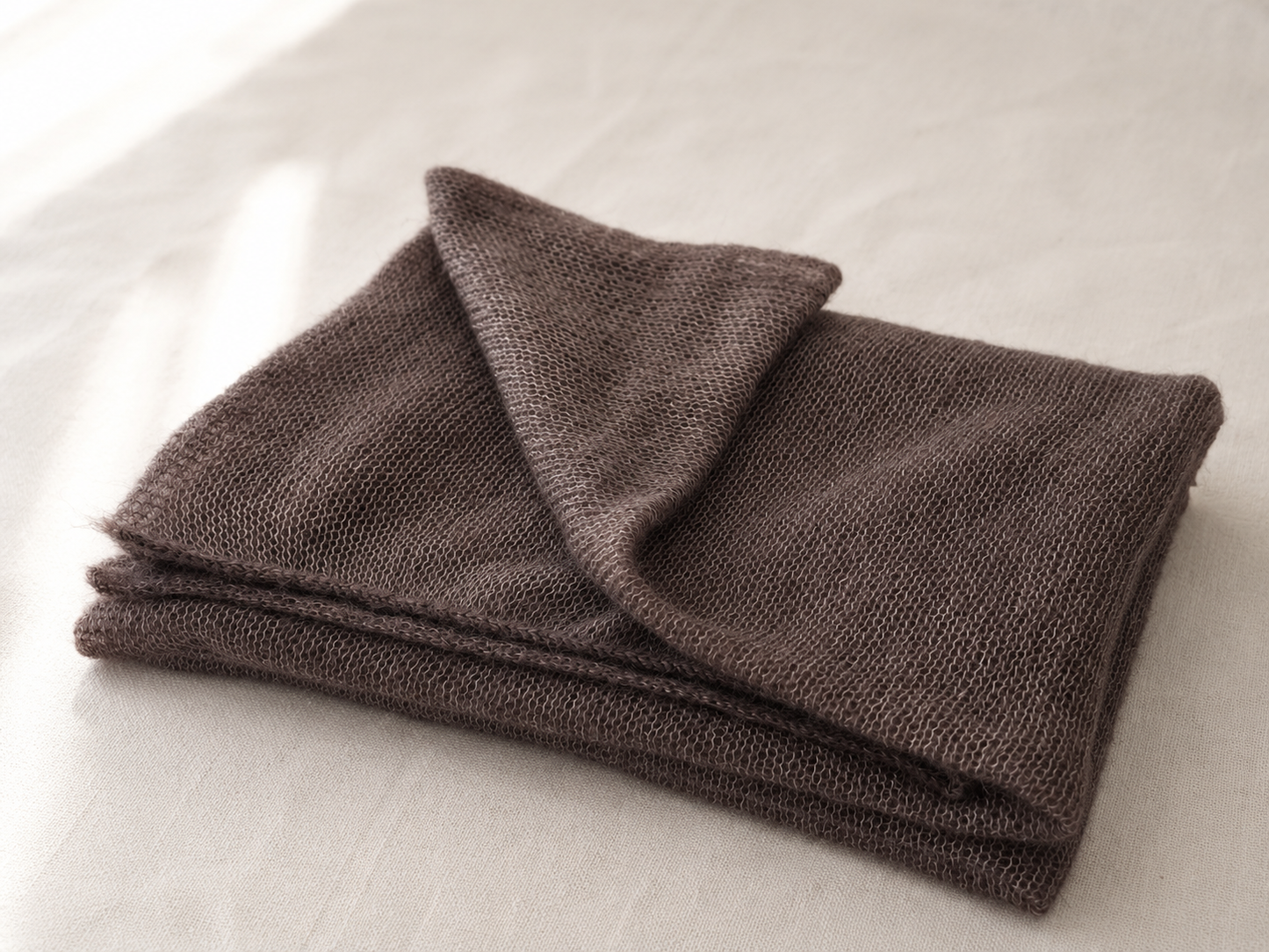 Folded Warm Taupe silk mohair shawl highlighting its soft airy texture