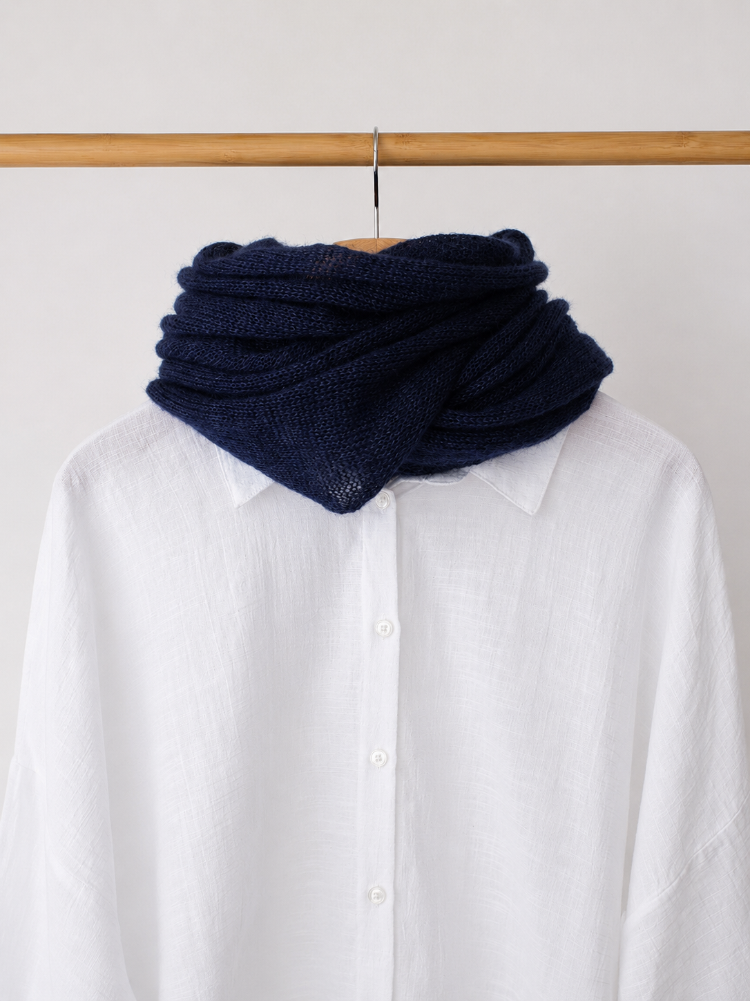 Midnight navy infinity scarf styled with a white linen shirt.
