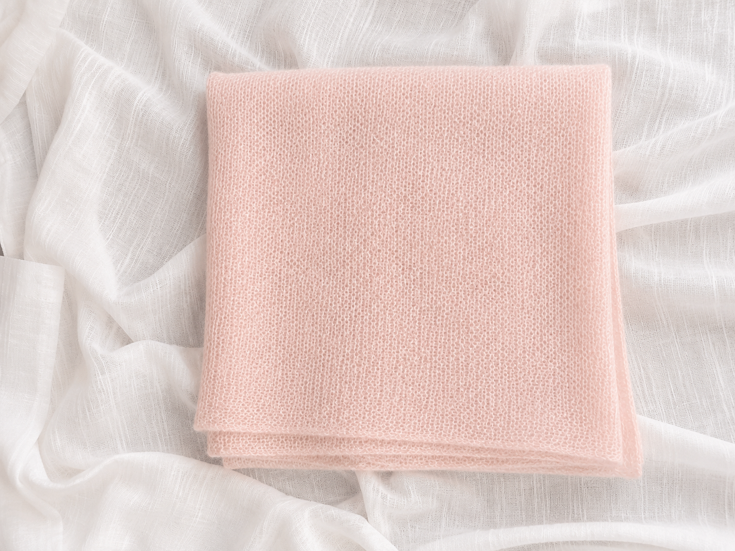 Flat lay of the Blush Pink knitted infinity scarf.