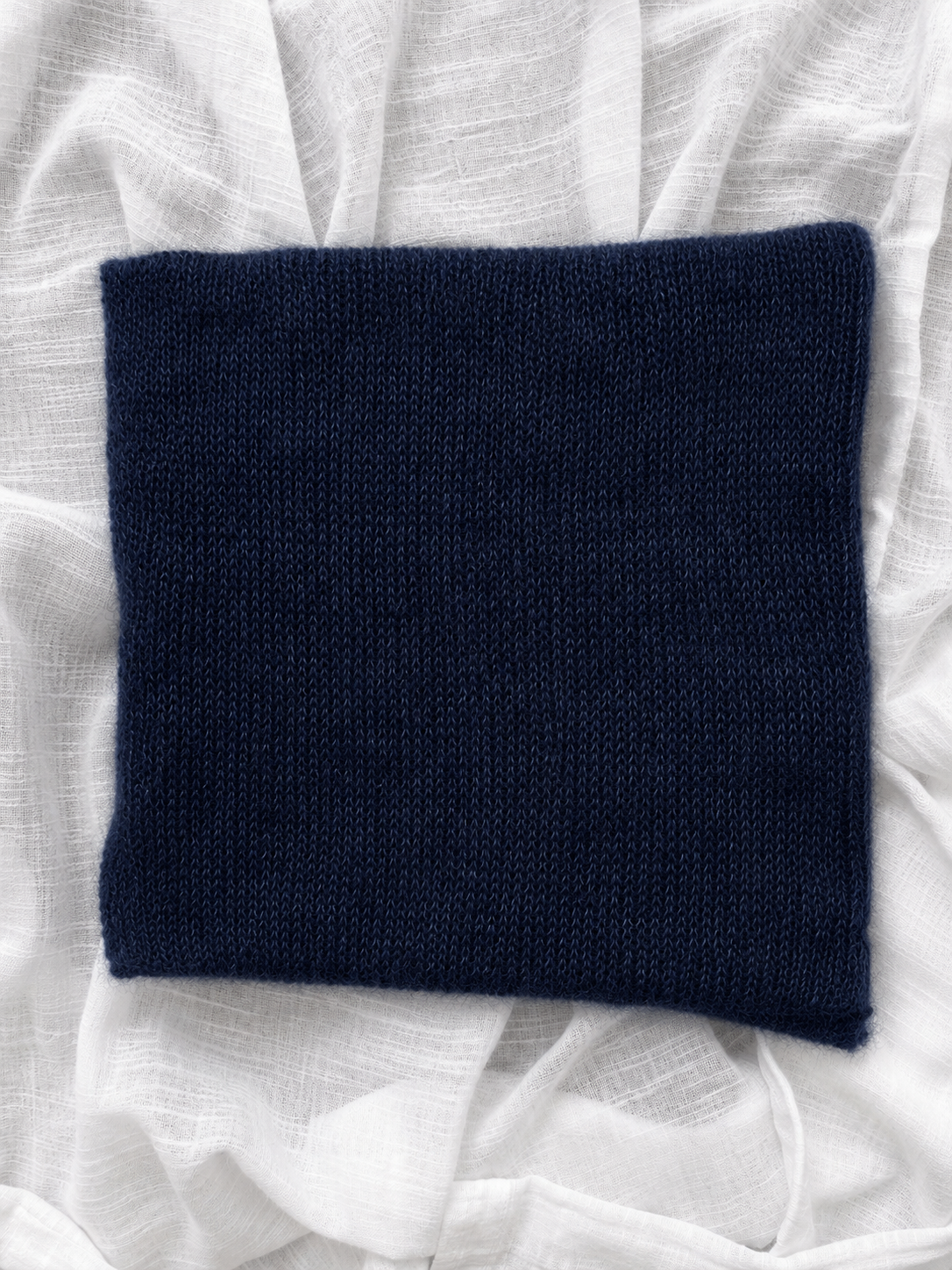Knit texture of a midnight navy silk mohair infinity scarf.