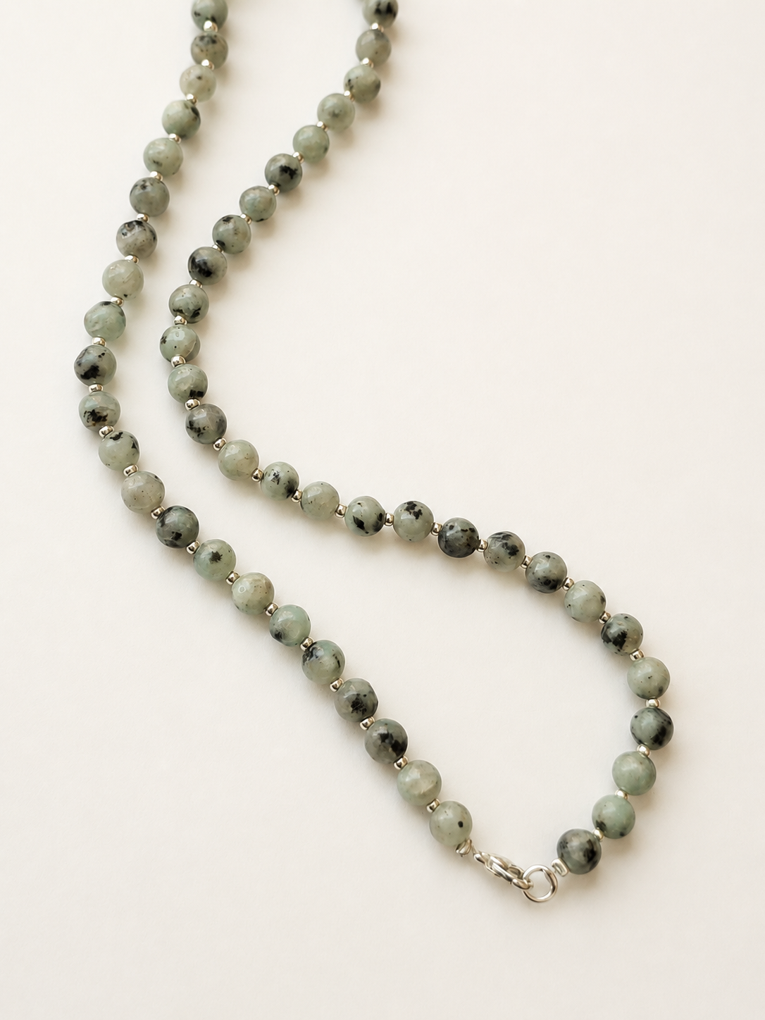 Full 42cm kiwi jasper necklace arranged lengthwise with silver Miyuki spacers and stainless steel clasp