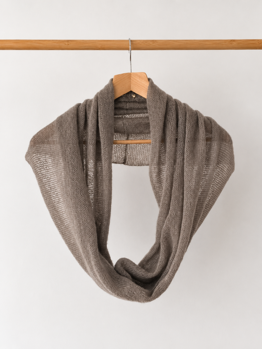 Front view of a mushroom taupe infinity loop scarf.