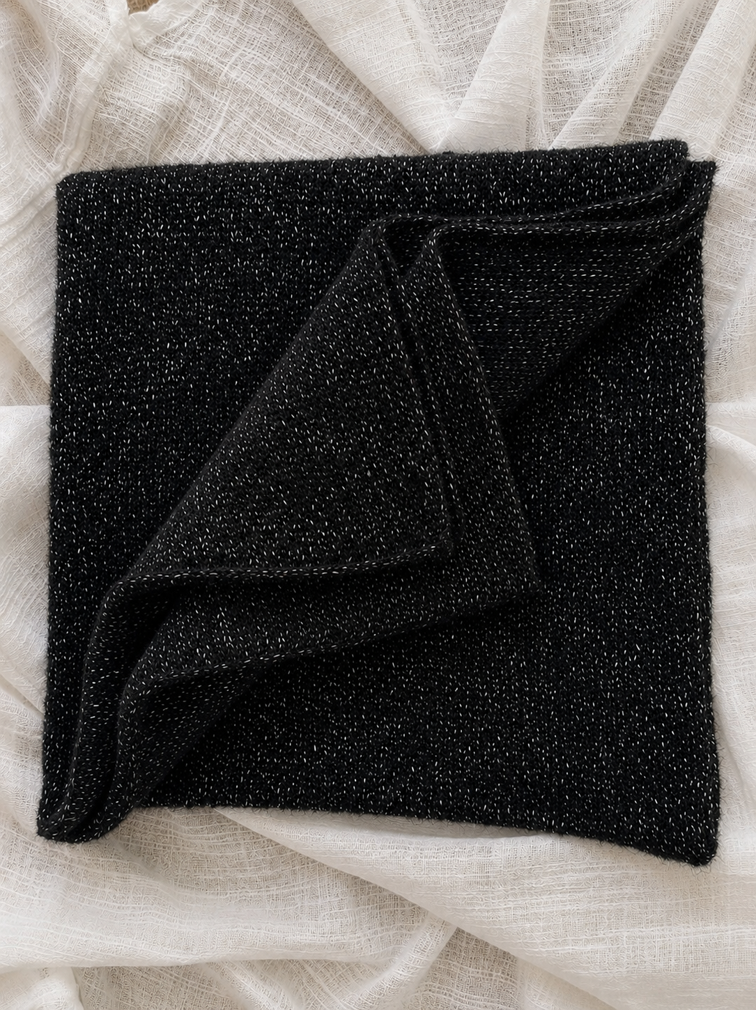 Folded black infinity loop scarf with soft mohair texture and silver sparkle
