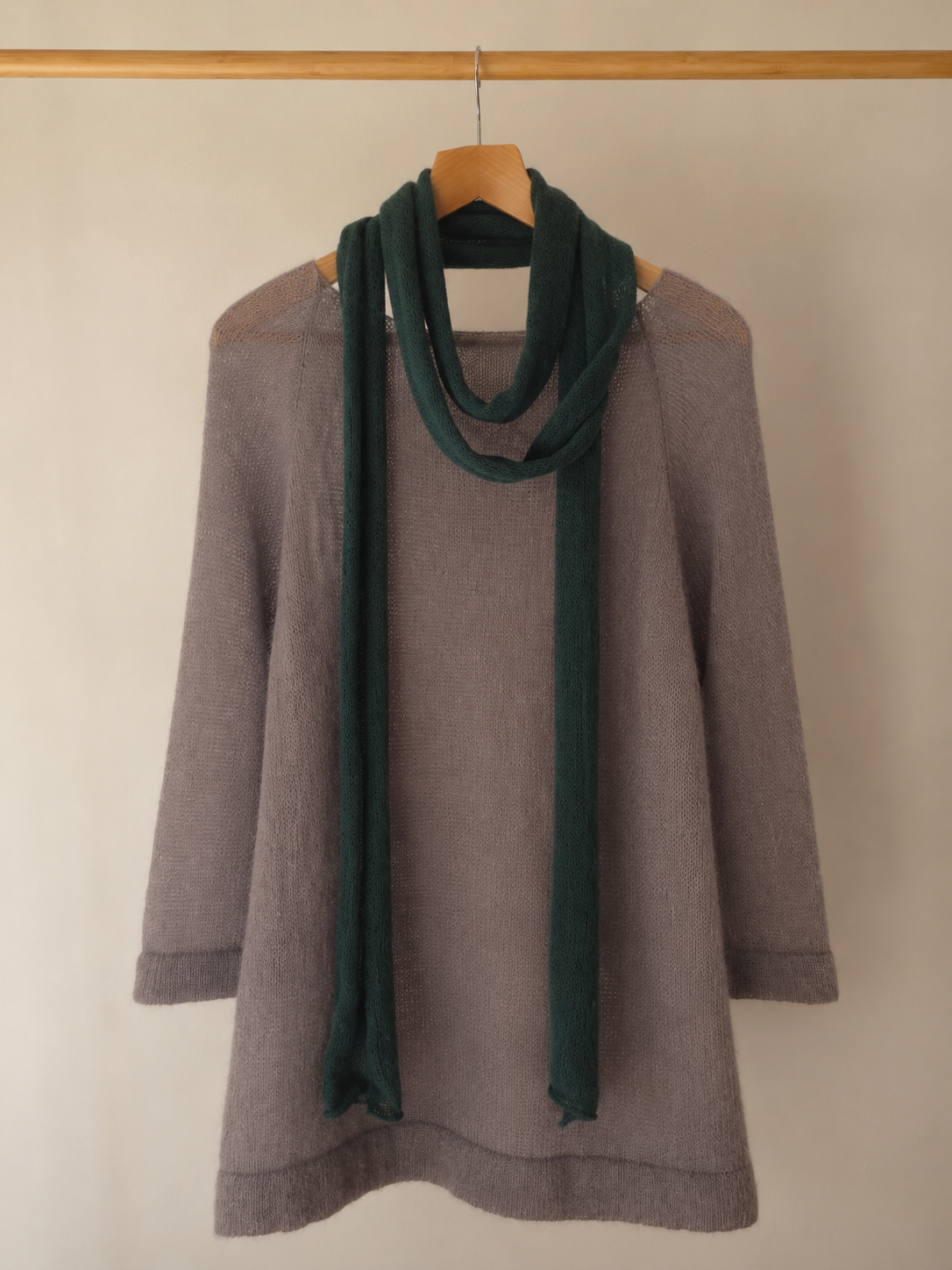 Deep forest green skinny mohair scarf styled with a taupe knit sweater.