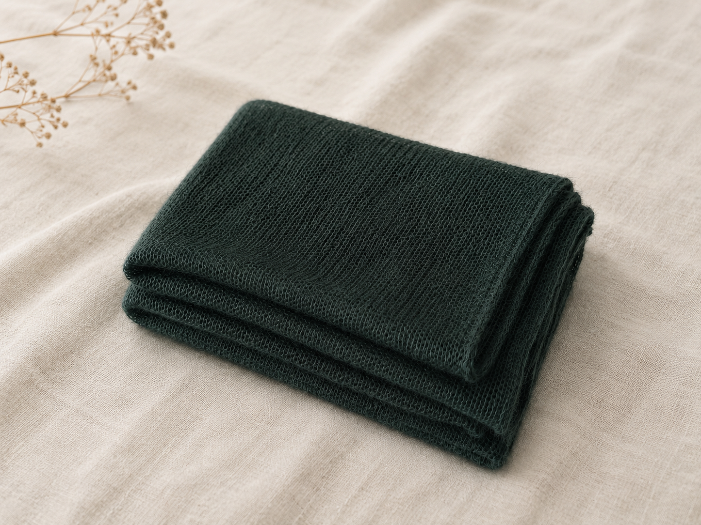 Folded Deep Forest silk mohair shawl highlighting its smooth knit and soft texture