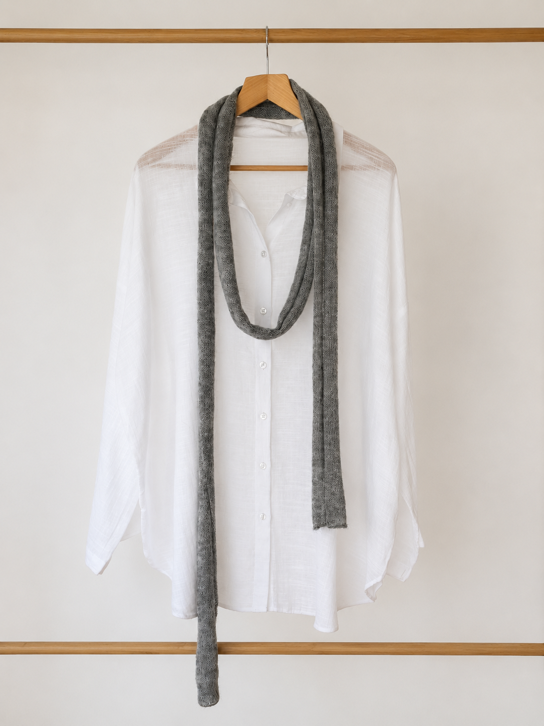 Cloud grey handmade kid mohair silk skinny scarf styled over a white linen shirt.