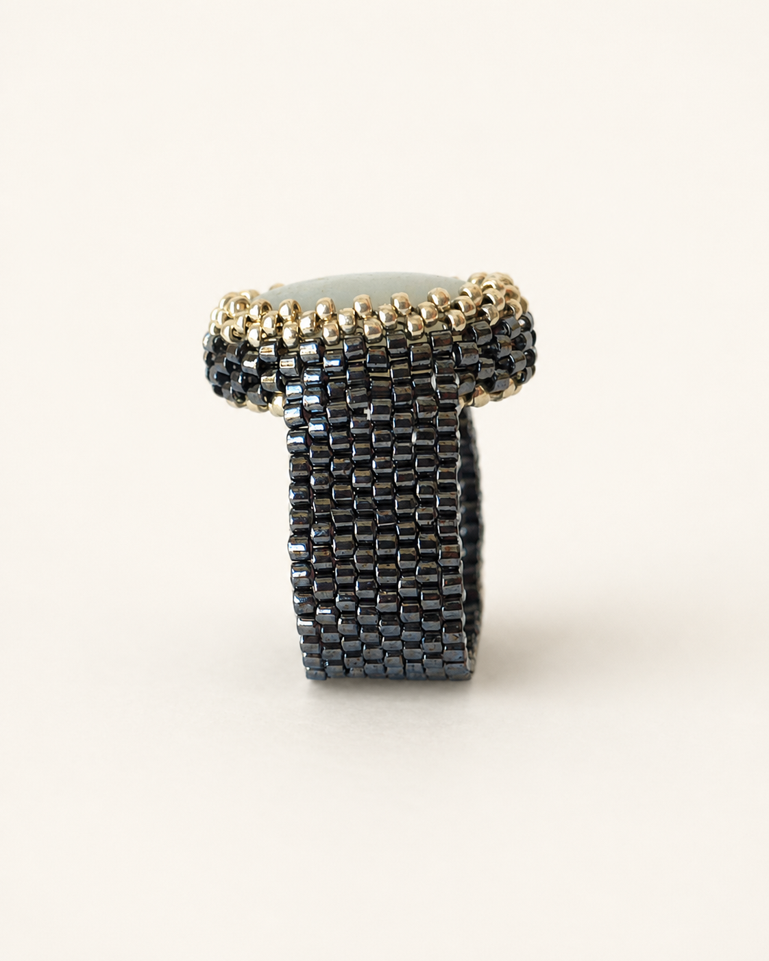 Amazonite statement ring side profile showing oval gemstone and wide gunmetal Miyuki beaded band