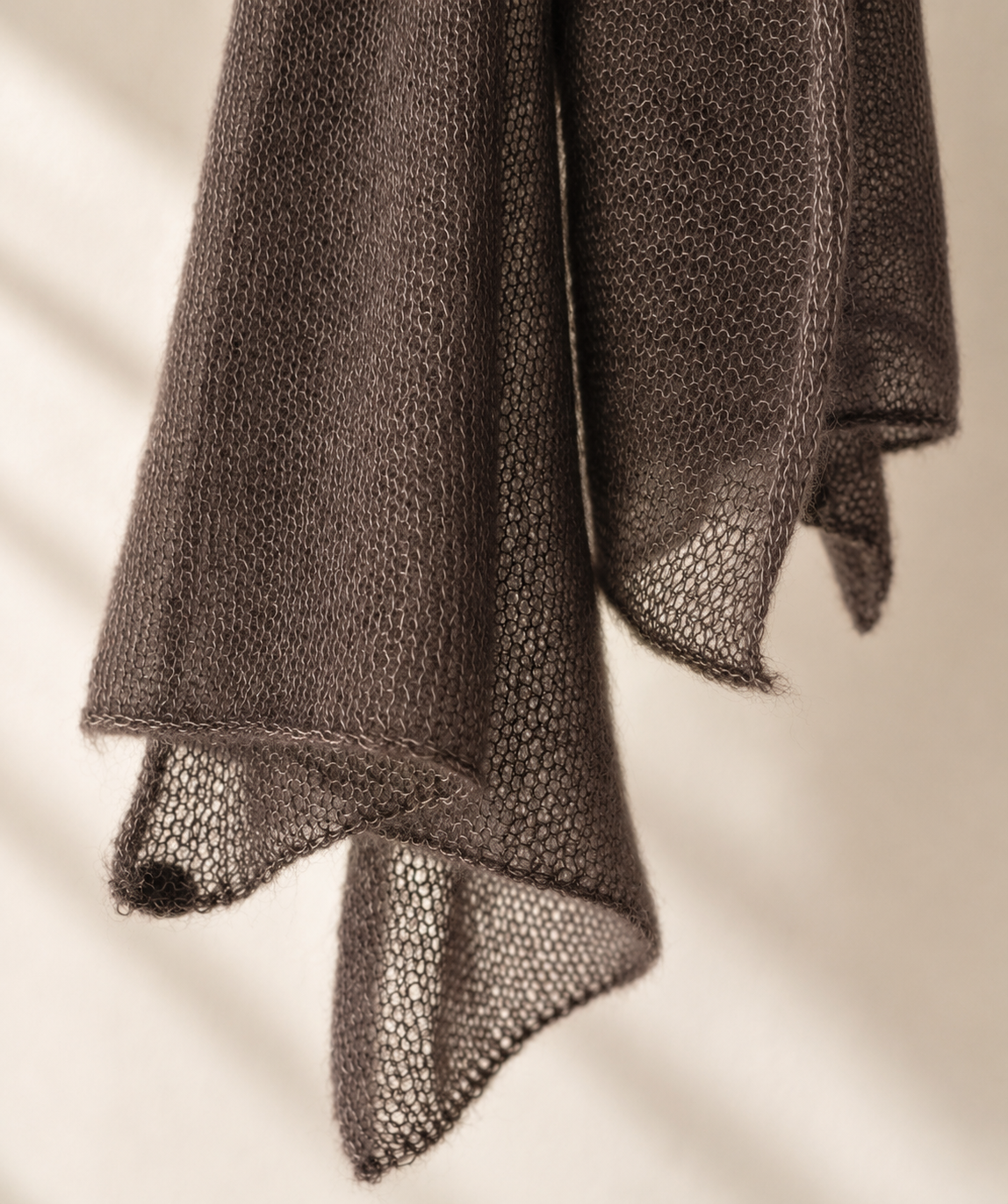 Close-up of the Warm Taupe silk mohair shawl showing the fine knit texture and delicate edges