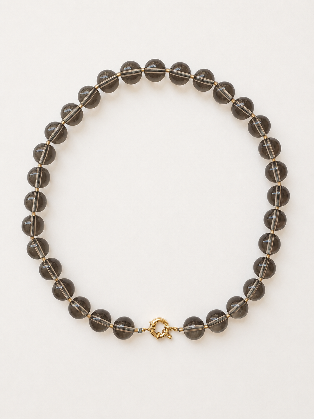 Smoky quartz necklace with 12mm translucent beads, gold-lined crystal accents and gold-colour clasp