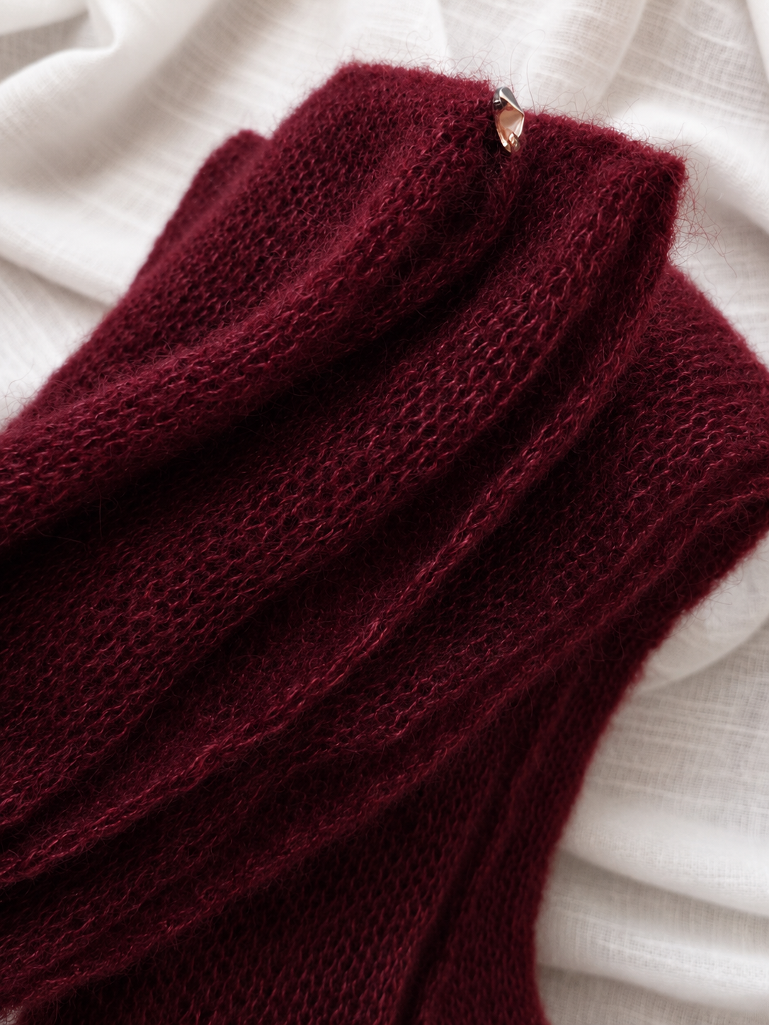 Close-up of the kid mohair texture and crystal detail.