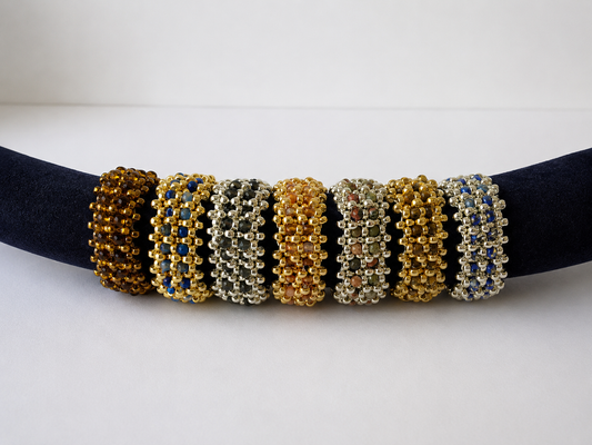 Seven Miyuki beaded band ring variants with gemstones and Preciosa glass in gold, silver and bronze tones