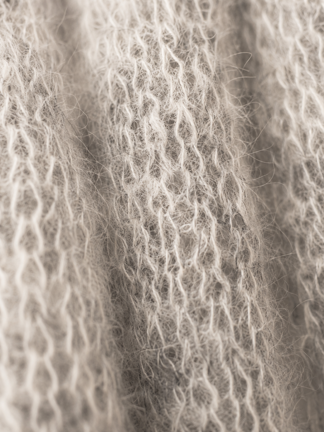 Close-up showing the natural fluffy halo of kid mohair fibres.
