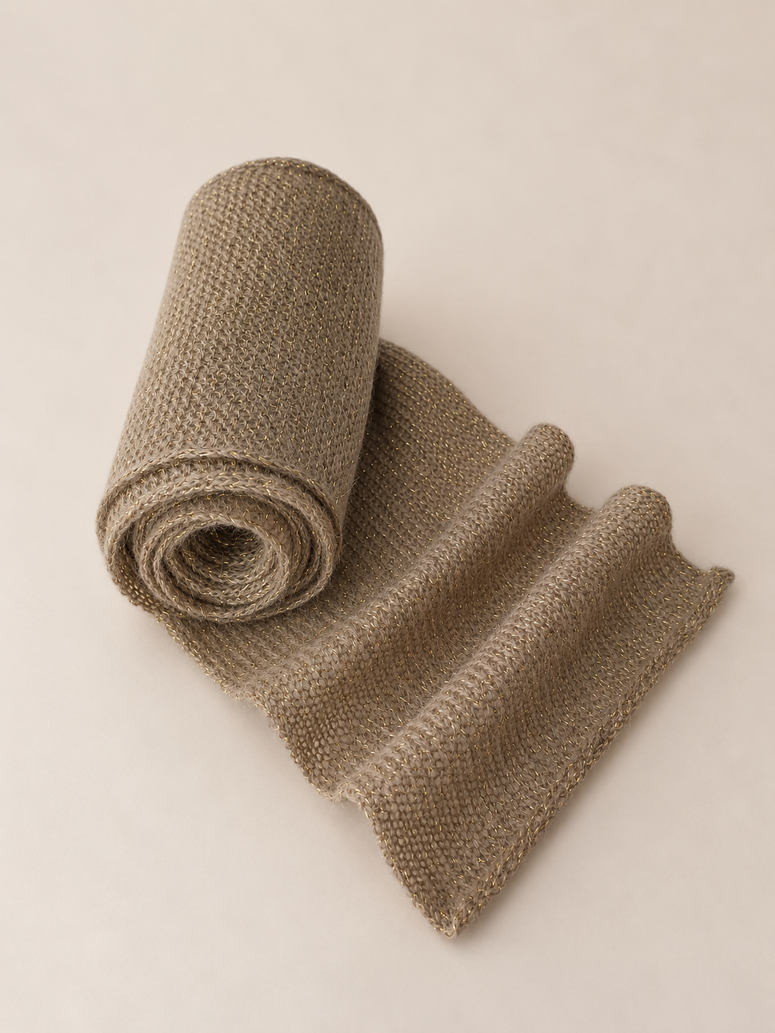 Rolled mohair scarf showing lightweight knit texture.