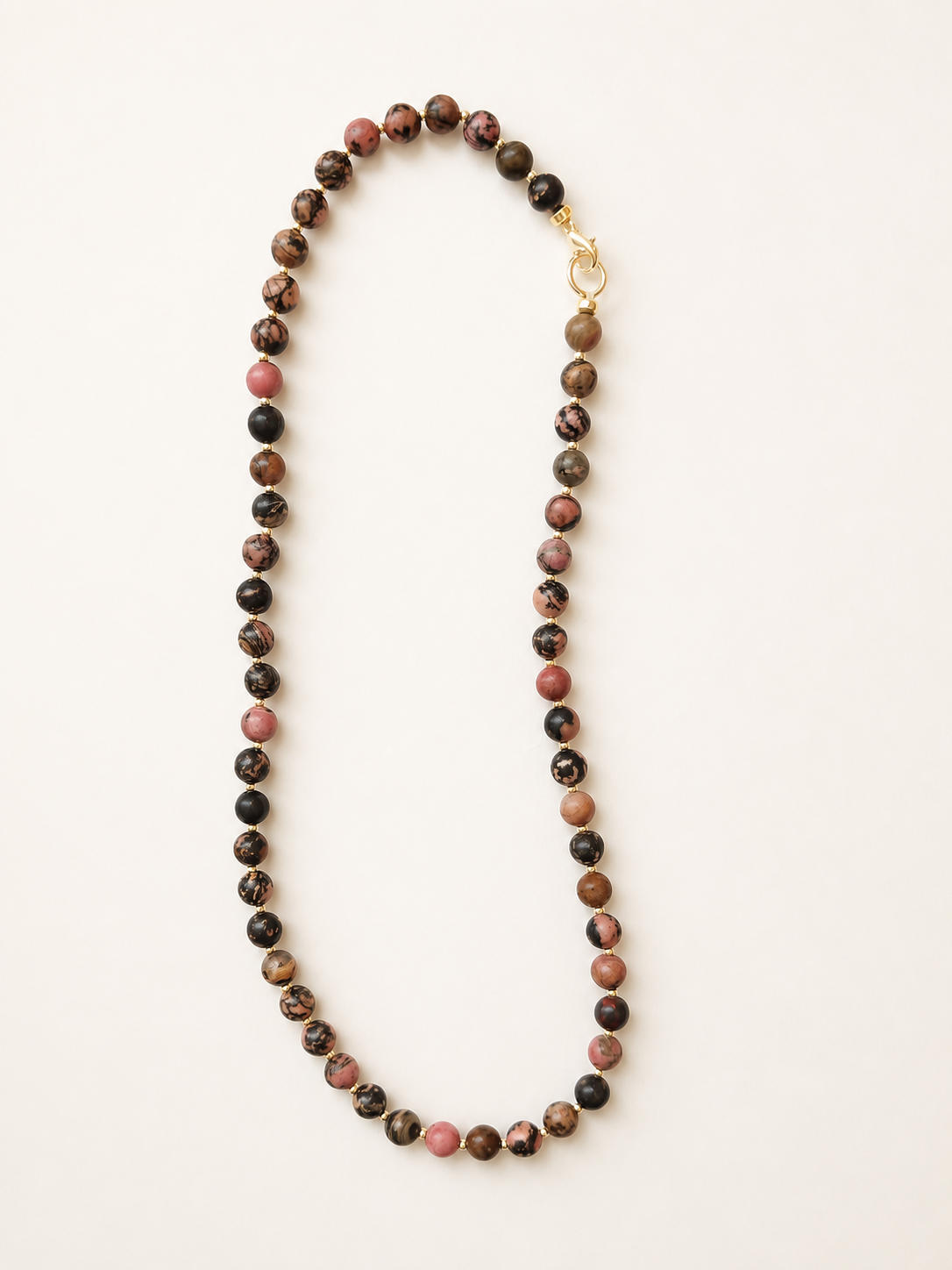 Full-length rhodonite necklace showing 6mm gemstone beads and stainless steel clasp
