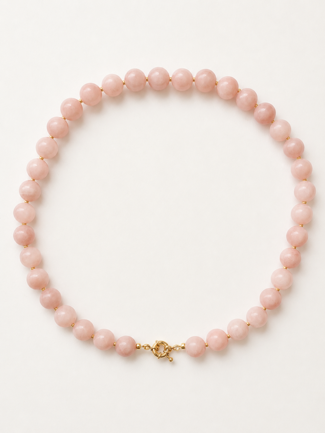 Blush pink jadeite necklace with 10mm beads and golden Miyuki accents shown in a full circular arrangement.