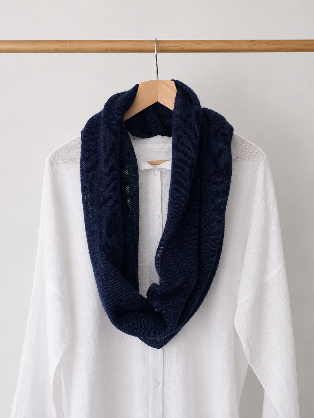 Lightweight silk mohair infinity scarf worn over a white shirt.