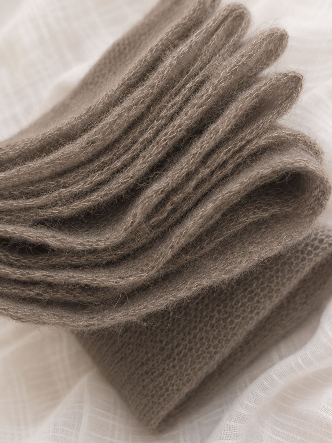 Close-up of the natural mohair halo on a taupe infinity scarf.