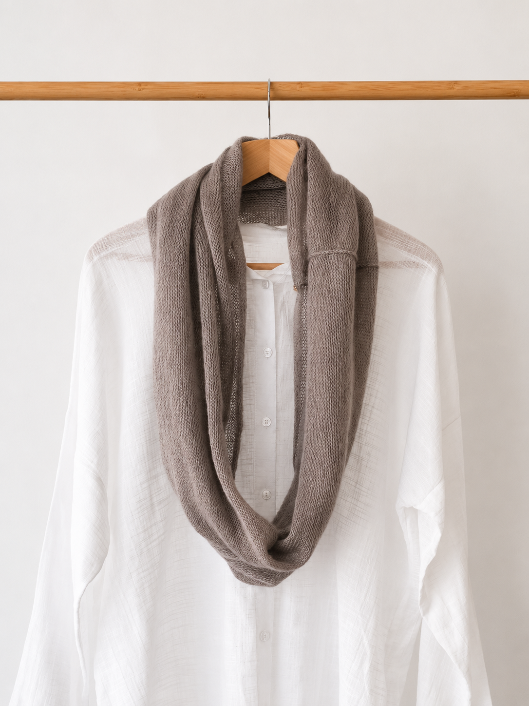 Lightweight mushroom taupe loop scarf worn over a white shirt.
