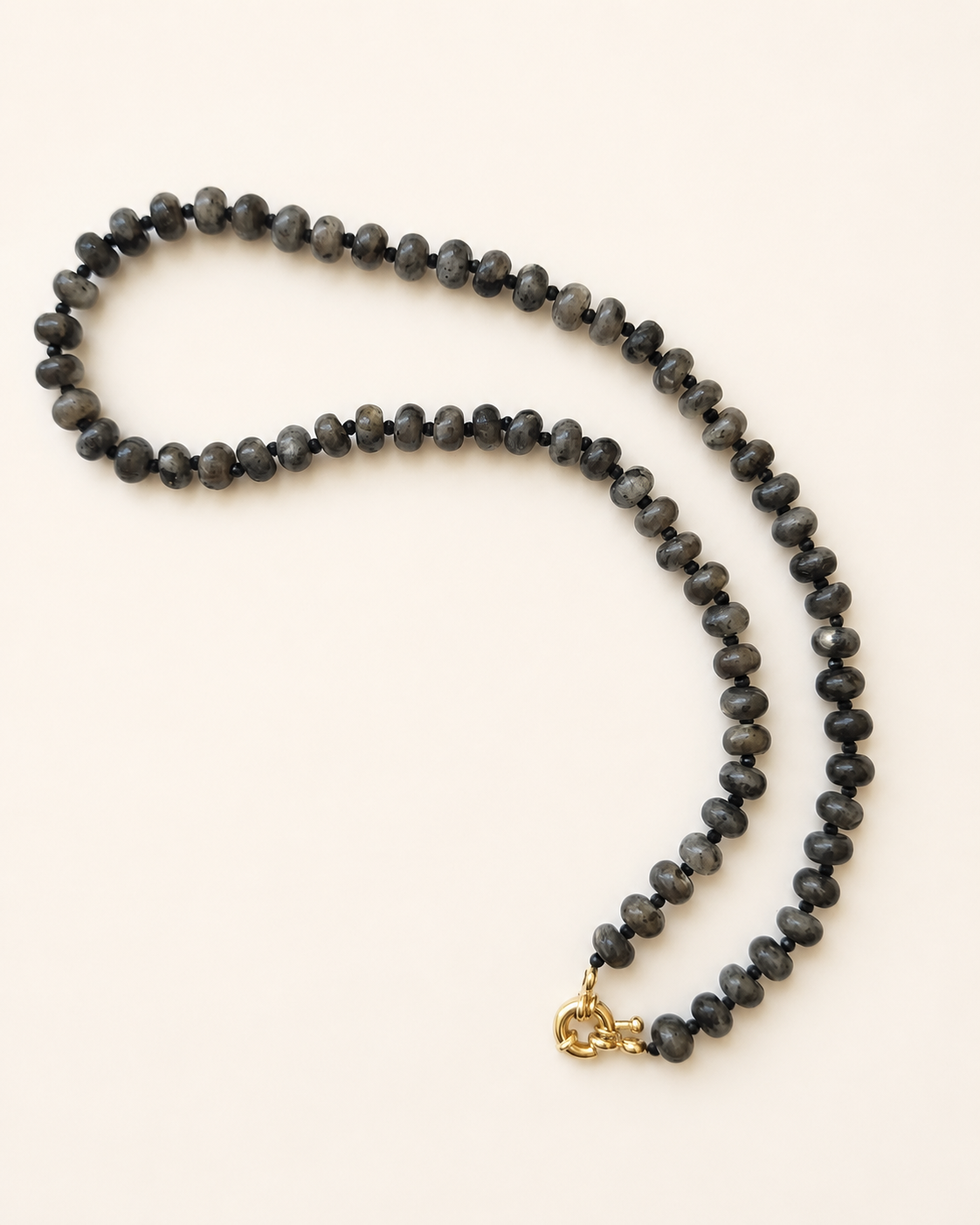 Full-length arrangement of a 42cm labradorite necklace with black gemstone accents