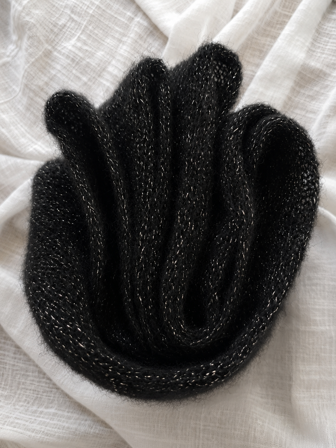 Detailed texture of black mohair blend infinity scarf with silver sparkle