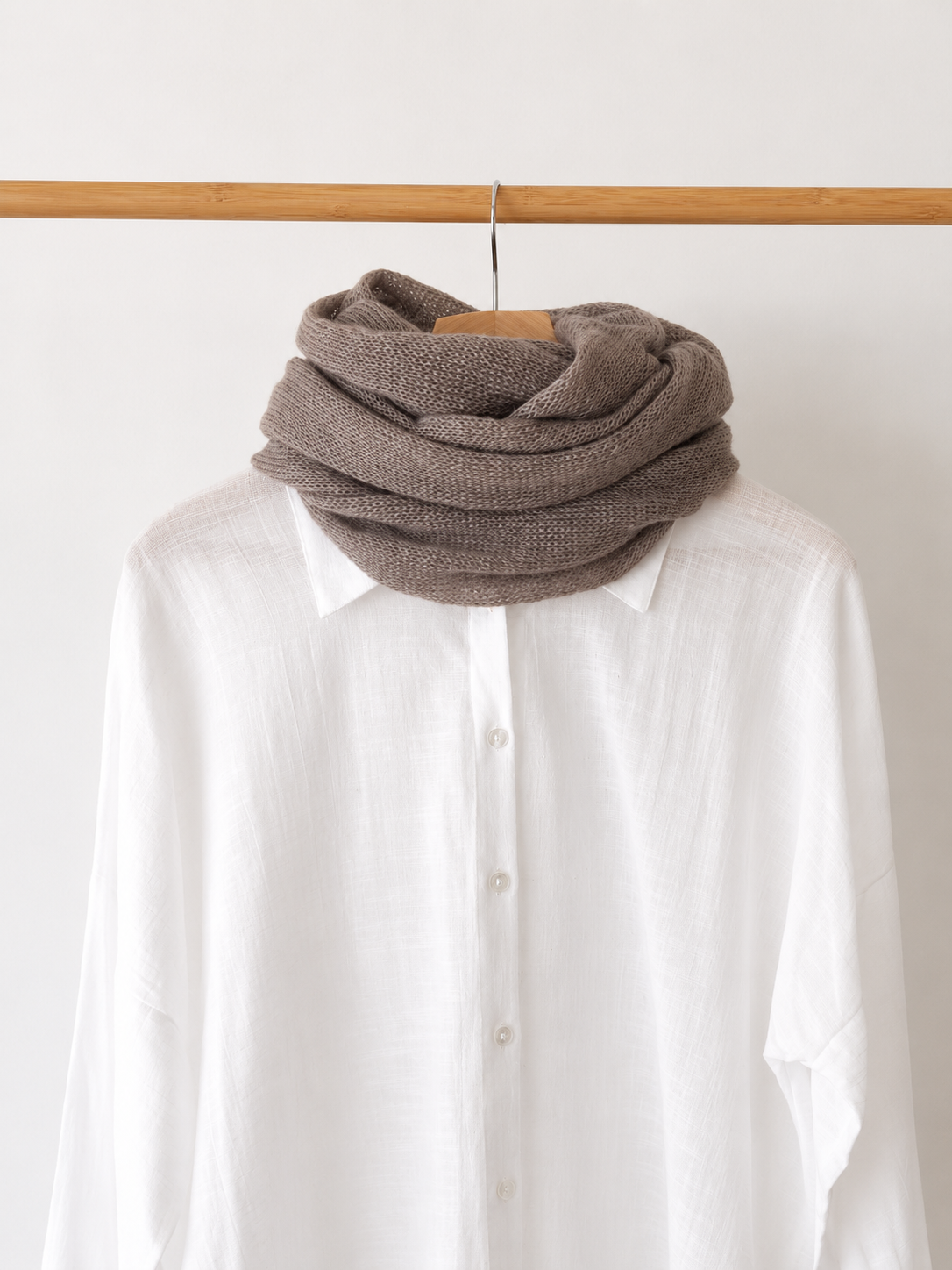 Taupe infinity scarf styled with a white linen shirt.